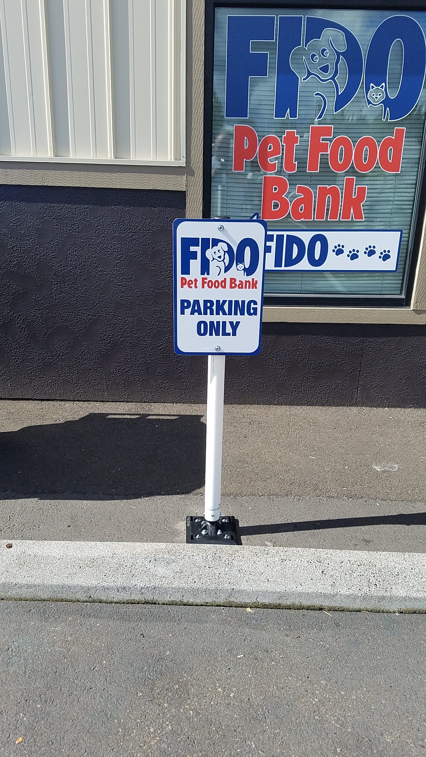 Custom parking sign for FIDO Pet Food Bank, designed, manufactured and installed by OC Sign Group in Portland, Oregon.