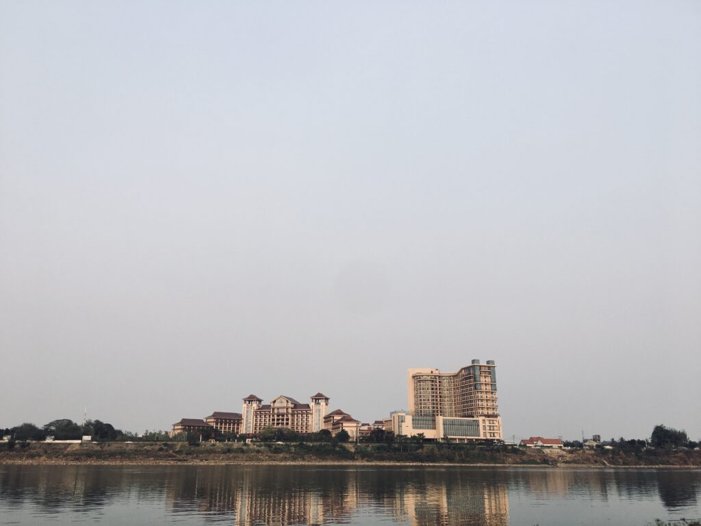Modern buildings near waterfront under clear sky