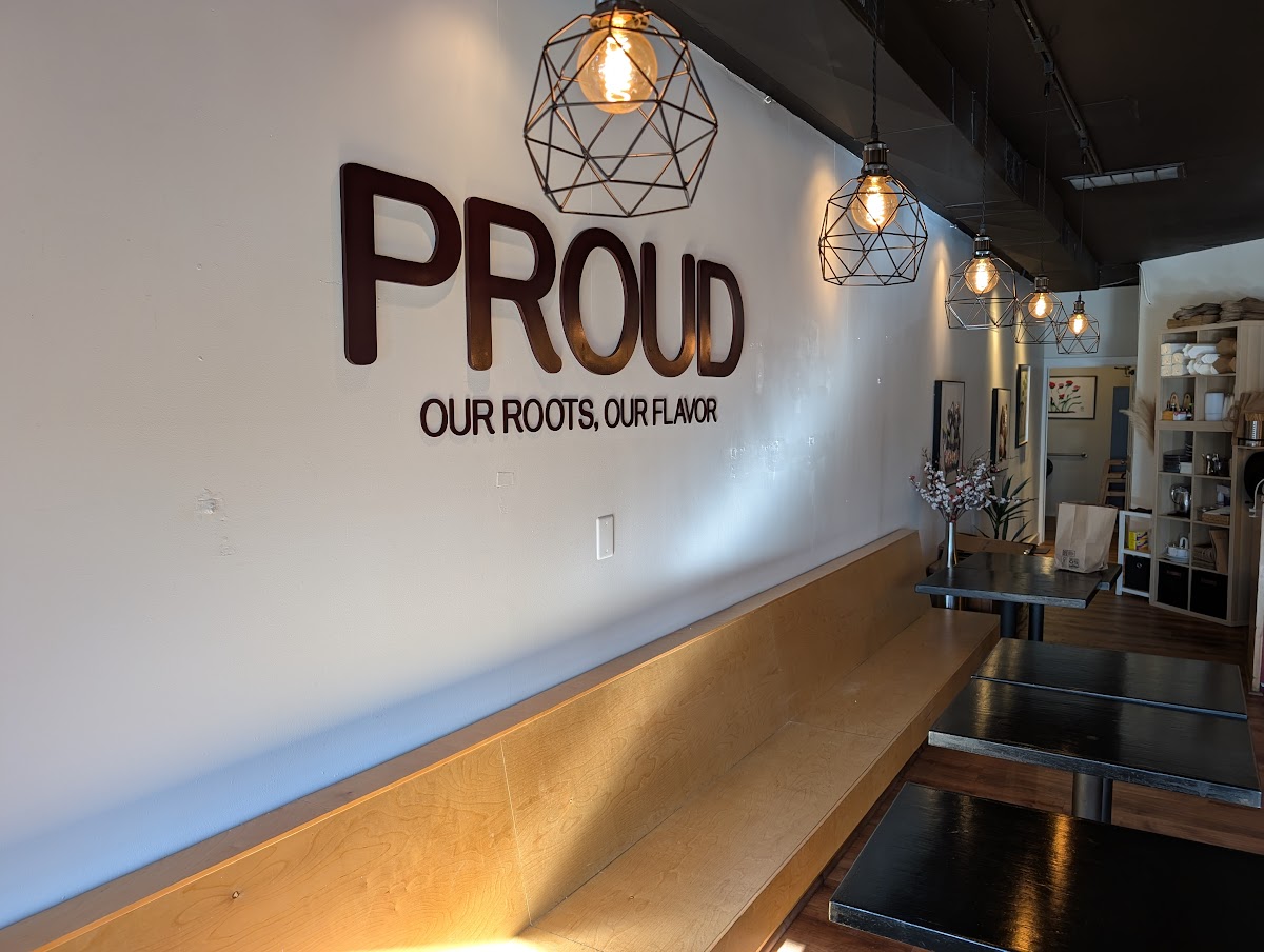 Dimensional acrylic lobby sign with individual letters on a white wall in Portland, OR.