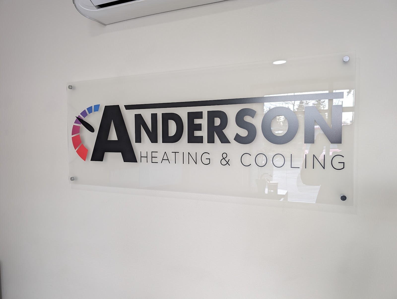 Clear acrylic lobby sign with black and colored vinyl graphics in Portland, OR.
