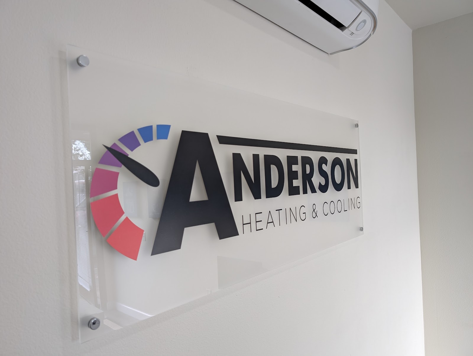 Clear acrylic lobby sign with black and colored graphics in Portland, OR.