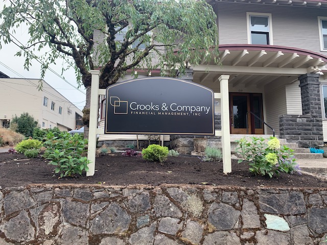 Rectangular post and panel sign with black face and white posts in Portland, OR.