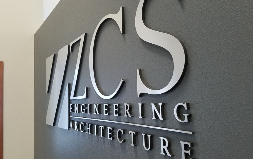 Custom dimensional lobby sign with metallic letters for an engineering and architecture office